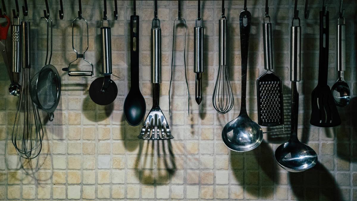 Stainless steel egg poacher pan showcasing tools and equipment in egg preparation